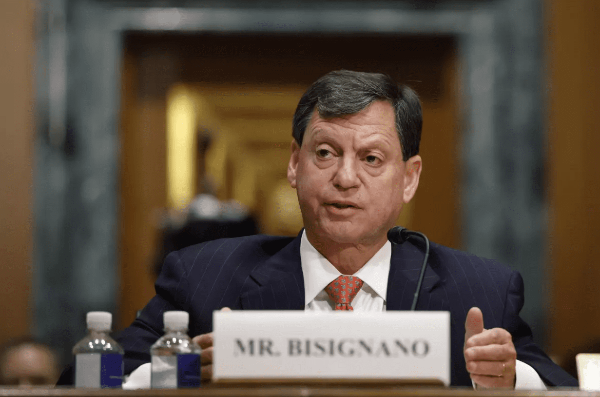 IRS CEO Frank Bisignano sitting at court.